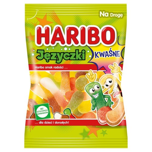 Opakowanie Haribo Języczki Kwaśne z widocznymi w środku kolorowymi, kwaśnymi żelkami. Na zielonej torebce znajdują się wesołe, kreskówkowe postacie oraz hasła "Haribo smak radości" i "Bez sztucznych barwników".