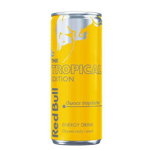 Żółta puszka napoju energetycznego Red Bull The Tropical Edition. Na puszce napis "Owoce tropikalne" i logo byka.
