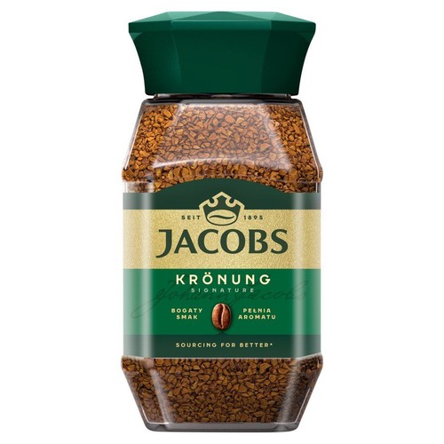 Kawa rozpuszczalna Jacobs Krönung w szklanym słoiku z zieloną, fasetowaną pokrywką. Widoczne granulki kawy.