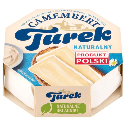 Opakowanie sera Camembert Turek Naturalny, z etykietą w kolorze beżowym i niebieskim. Na wieczku widoczna jest propozycja podania: dwa kawałki sera na kromce chleba oraz mała miseczka z sosem. Produkt Polski, z naturalnymi składnikami.