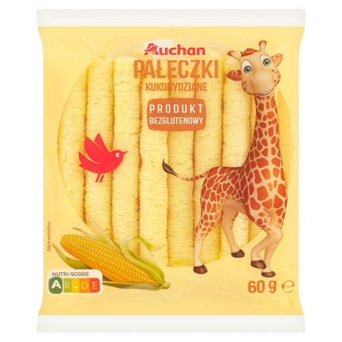 Żółte opakowanie paleczek kukurydzianych Auchan, 60g. Produkt bezglutenowy. Na opakowaniu grafika uśmiechniętej żyrafy, czerwonego ptaka i kolby kukurydzy. W środku widoczne jasne paleczki.