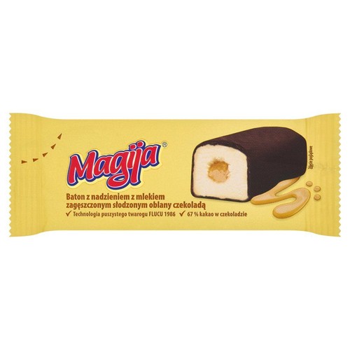 Opakowanie batona Magija. Baton z nadzieniem z mleka zagęszczonego słodzonego, oblany czekoladą. Na opakowaniu grafika przekroju.