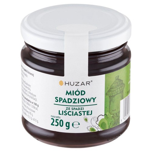 Słoik miodu Huzar Spadziowy Liściasty, 250g. Ciemny miód, biała zakrętka, biało-zielona etykieta.