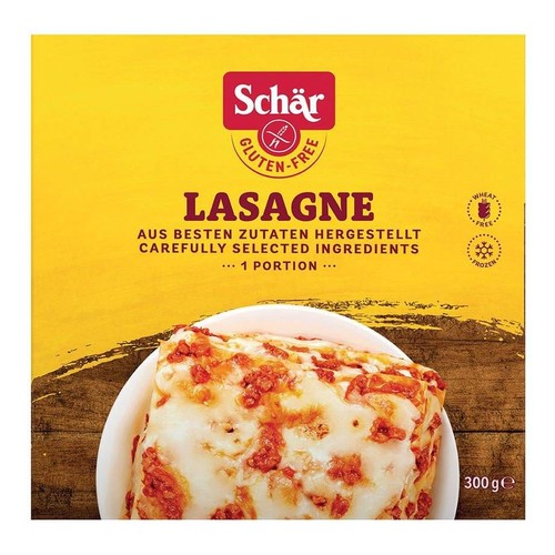 Lasagne Schär, 300g, bezglutenowa i bez pszenicy. Grafika porcji lasagne z sosem i serem. Produkt mrożony.