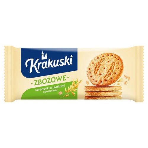 Krakuski Zbożowe, herbatniki owsiane w beżowym opakowaniu. Widoczne ciastka z wzorem zboża i płatki owsiane.