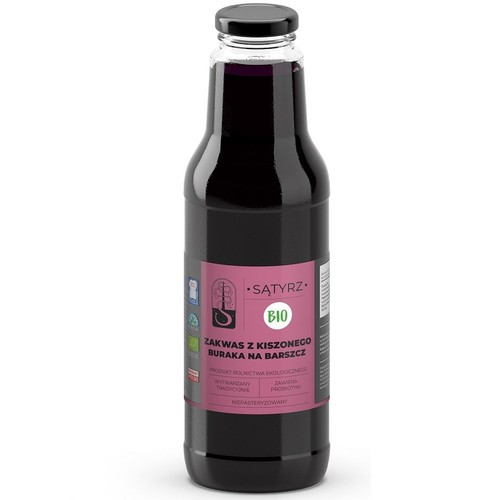 Zakwas buraczany Sątyrz BIO w przezroczystej szklanej butelce z czarną zakrętką. Jest to produkt ekologiczny, tradycyjnie wytwarzany i niepasteryzowany, zawierający probiotyki. Przeznaczony do przygotowania barszczu.