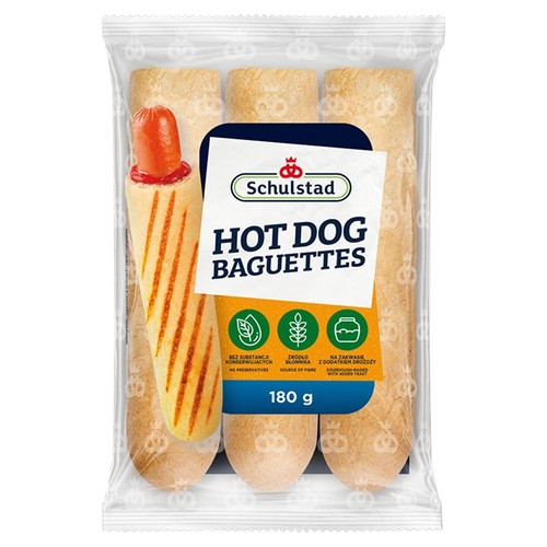Przezroczyste opakowanie Schulstad Hot Dog Baguettes o wadze 180 g. W środku widoczne są trzy podłużne bułki. Na etykiecie informacja: bez substancji konserwujących, źródło błonnika, na zakwasie z dodatkiem drożdży.