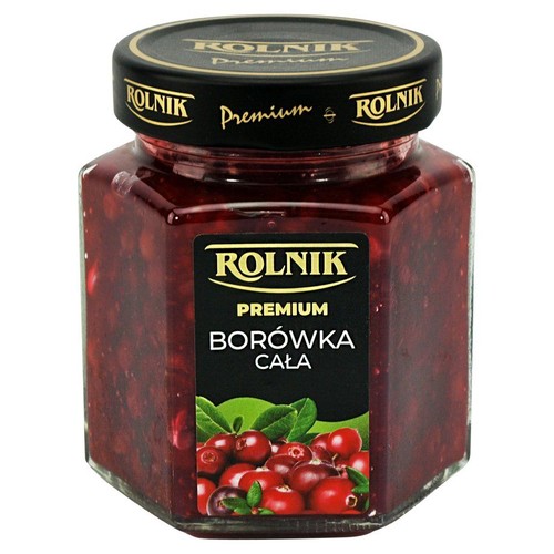 Słoik ROLNIK Premium Borówka Cała, wypełniony gęstym dżemem z całych, ciemnoczerwonych borówek. Na etykiecie widać świeże owoce.