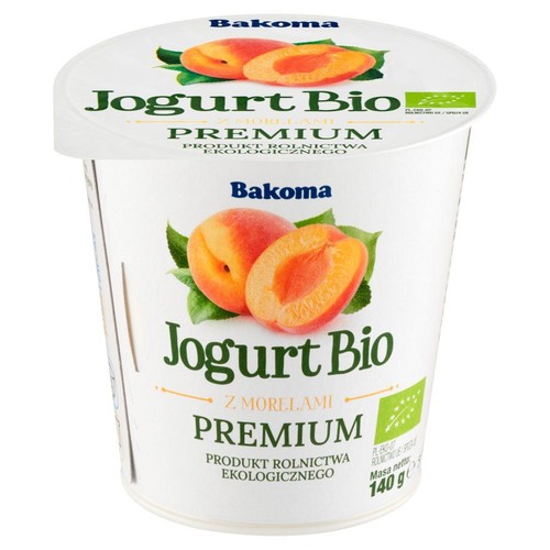 Organiczny jogurt Bakoma z morelami, 140g. Na białym kubku grafika owoców. Certyfikowany produkt ekologiczny.