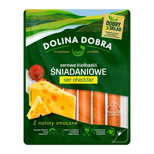 Opakowanie kiełbasek śniadaniowych Dolina Dobra z serem cheddar. Zielone tło, grafika sera i kiełbasek. Z natury smaczne.