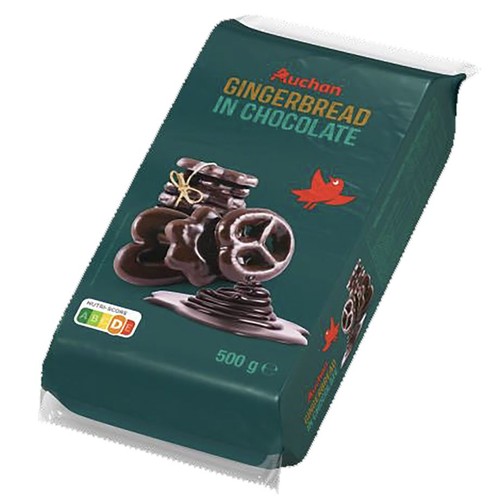 Ciemnozielone opakowanie pierników w czekoladzie marki Auchan, o wadze 500 g. Na froncie widnieje apetyczna grafika przedstawiająca różnokształtne pierniki, takie jak gwiazdki i precle, obficie oblane ciemną czekoladą.