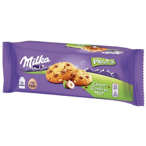 Milka Pieguski Choco Cookies Nut w fioletowym opakowaniu. Na opakowaniu grafika ciasteczek z kawałkami czekolady i orzechami laskowymi.