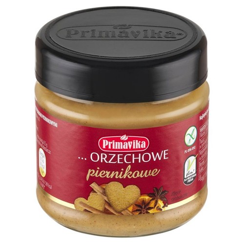 Słoik kremu orzechowego Primavika o smaku piernikowym. Na etykiecie grafika pierników, cynamonu i anyżu. Produkt wegański.