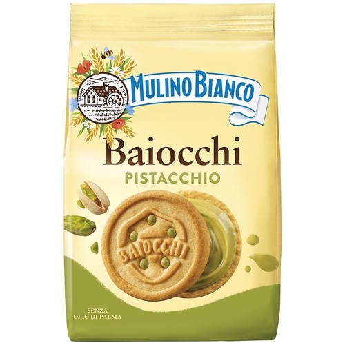 Mulino Bianco Baiocchi Pistacchio, ciastka w żółto-zielonym opakowaniu. Na froncie grafika dwóch okrągłych ciastek z zielonym kremem pistacjowym i pistacjami. Opakowanie podkreśla, że produkt jest bez oleju palmowego.