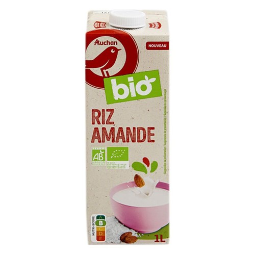 Napój roślinny Auchan Bio Ryżowo-Migdałowy w kartonie 1L. Na opakowaniu grafika miski z płynem, ryżem i migdałami.