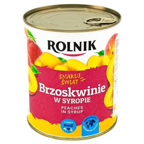 Puszka brzoskwiń w syropie ROLNIK. Etykieta z grafiką połówek brzoskwiń i napisem "Brzoskwinie w syropie".
