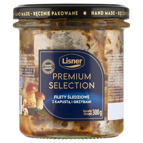 Produkt Lisner Premium Selection: filety śledziowe z kapustą i grzybami, zapakowane w przezroczysty szklany słoik. Etykieta informuje o ręcznym pakowaniu i masie netto 300g. Widoczna jest grafika grzybów.