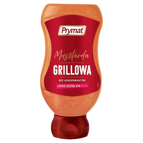 Prymat Musztarda Grillowa w pomarańczowej butelce. Etykieta informuje o braku konserwantów i lekkiej ostrości.