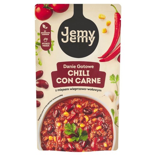 Opakowanie dania gotowego Jemy Jemy Chili Con Carne z mięsem wieprzowo-wołowym. Produkt w torebce, z informacją "Bez konserwantów i barwników" oraz "Wystarczy podgrzać". Na opakowaniu grafiki warzyw i miska z chili.