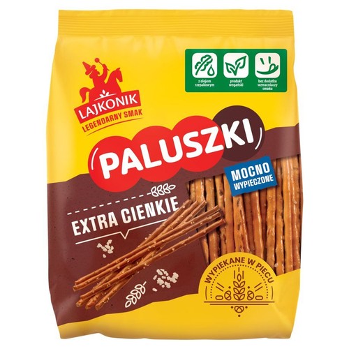 Opakowanie paluszków Lajkonik Extra Cienkie. Wypiekane w piecu, z olejem rzepakowym. Na opakowaniu wizerunek paluszków.