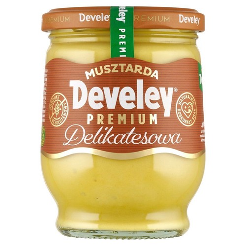 Słoik musztardy Develey Premium Delikatesowa. Na brązowej etykiecie widnieje nazwa produktu. Produkt jest bezglutenowy, co potwierdza specjalne oznaczenie. Posiada naturalnie doskonały smak.