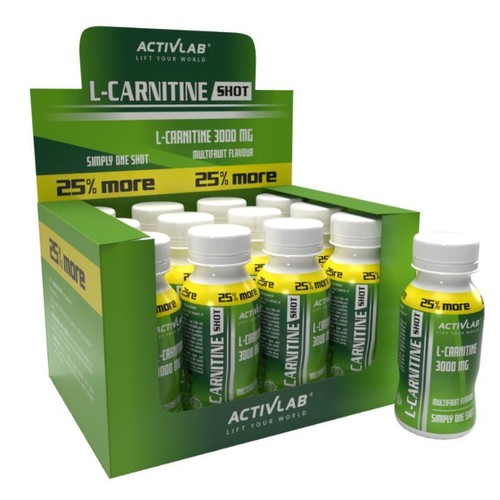 Karton ekspozycyjny ACTIVLAB L-CARNITINE SHOT 3000 mg, smak multifruit. Opakowanie jest zielone z żółtymi akcentami i napisem "25% więcej". W środku widoczne są rzędy żółto-zielonych butelek. Jedna butelka stoi z przodu, prezentując etykietę produktu.