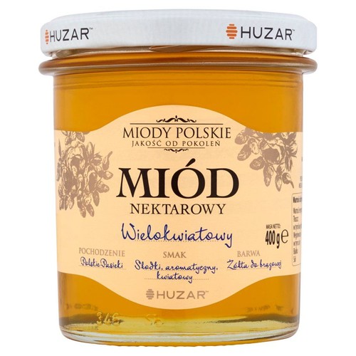 Szklany słoik miodu nektarowego wielokwiatowego marki Huzar, 400 gramów. Etykieta z kwiatowym wzorem.