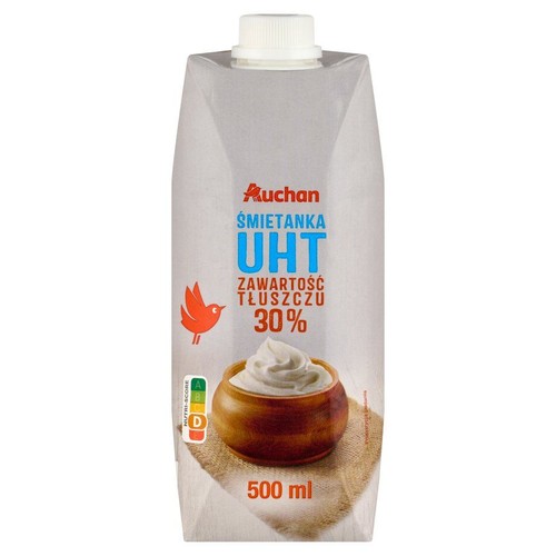 Karton śmietanki UHT Auchan 30% tłuszczu, 500 ml. Na opakowaniu grafika miseczki z bitą śmietaną i ptaka.