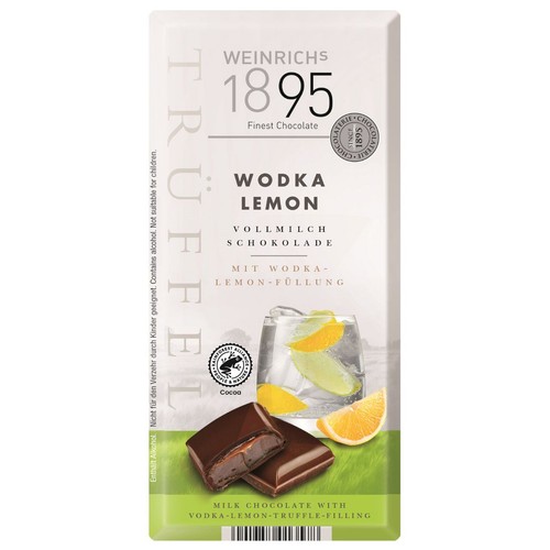 Czekolada mleczna Weinrichs 1895 Wodka Lemon z nadzieniem wódka-cytryna. Opakowanie przedstawia grafikę drinka z cytryną i lodu, a także dwa kawałki czekolady, z których jeden jest przekrojony. Produkt zawiera alkohol, nieodpowiedni dla dzieci.