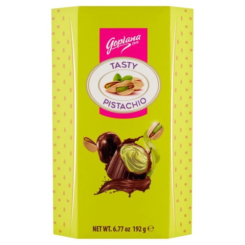 Produkt Goplana Tasty Pistachio w jasnozielonym pudełku z delikatnym wzorem. Na opakowaniu widnieje różowe logo Goplana oraz centralna grafika orzechów pistacjowych i czekoladek z pistacjowym kremem. Opakowanie informuje o wadze netto 192 gramów.