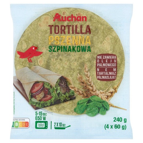 Auchan Tortilla Pszenna Szpinakowa, 4 sztuki po 60 g. Opakowanie z grafiką zawiniętych tortilli i świeżego szpinaku.