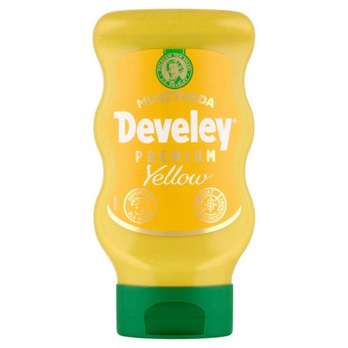 Produkt: musztarda Develey Premium Yellow w charakterystycznej, żółtej butelce z zielonym zamknięciem. Etykieta informuje o bezglutenowym składzie i pochodzeniu bezpośrednio z ziarna gorczycy.