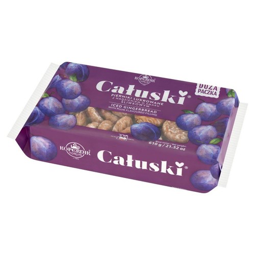 Opakowanie pierników Kopernik Całuski, lukrowanych, z nadzieniem śliwkowym, 610g. Fioletowa paczka z grafiką śliwek.