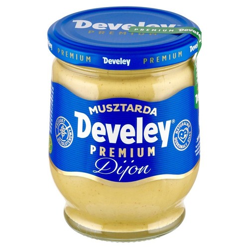 Słoik musztardy Develey Premium Dijon, 270g. Ma niebieską etykietę z białym napisem i niebieską zakrętkę. Produkt bezglutenowy.