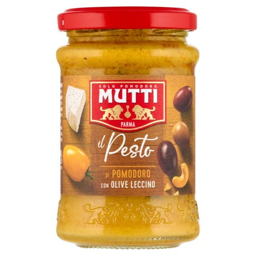 Pesto Mutti pomidorowe z oliwkami Leccino w szklanym słoiku z czerwoną zakrętką. Etykieta z grafikami składników: sera, pomidora, oliwek.