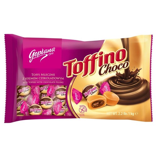 Fioletowo-złota torebka cukierków Toffino Choco, mlecznych toffi z kremem czekoladowym, 1 kg. Widoczne pojedyncze cukierki.