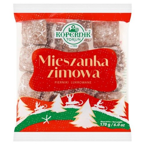 Opakowanie pierników lukrowanych Kopernik Mieszanka Zimowa, 170 g. Na czerwonej etykiecie białe choinki i renifery.