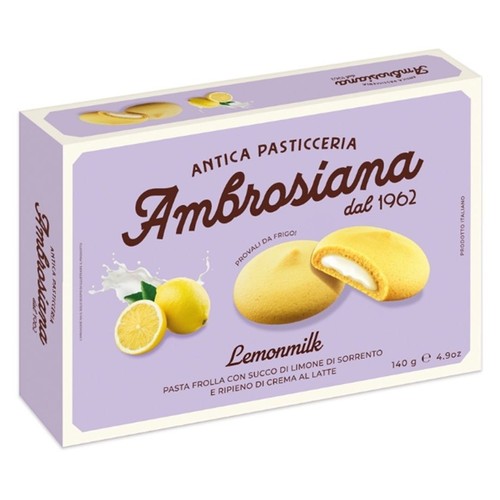Opakowanie ciastek Ambrosiana Lemonmilk, Stara Cukiernia od 1962. Przedstawia żółte ciastka z białym kremem, cytryny i mleko. Kruche ciastka z sokiem z cytryn z Sorrento i nadzieniem z kremu mlecznego.  