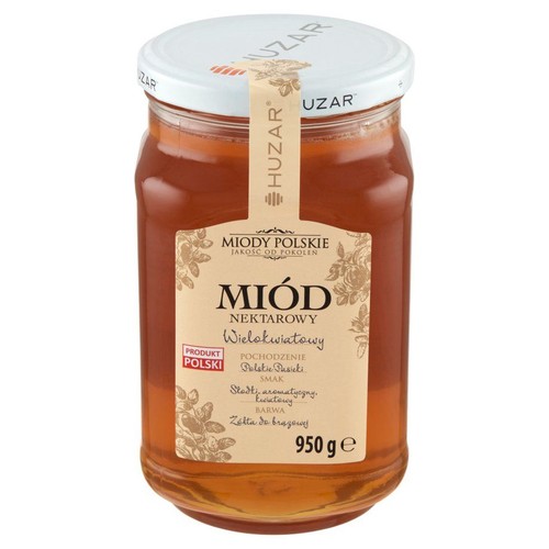 Miód nektarowy wielokwiatowy Huzar w przezroczystym słoiku o pojemności 950 g. Etykieta informuje, że to "Produkt Polski" z polskich pasiek. Opisuje smak jako słodki, aromatyczny i kwiatowy, a barwę jako żółtą do brązowej.