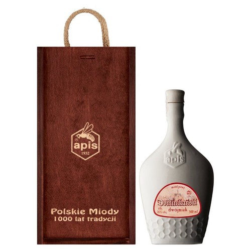 Zestaw prezentowy: biała butelka miodu pitnego Apis Dominikański dwójniak 500 ml, 16% obj., z etykietą i wytłoczonym logo. Obok elegancka, brązowa torebka z uchwytem, ozdobiona logo Apis i tekstem "Polskie Miody 1000 lat tradycji".