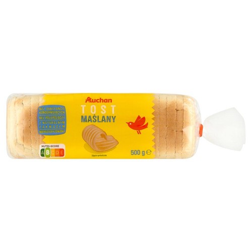 Opakowanie tostów maślanych Auchan, 500g. Pieczywo w przezroczystej folii z żółtą etykietą. Na etykiecie grafika zawiniętego masła i czerwonego ptaka. Produkt bez konserwantów, polepszaczy, z naturalnym zakwasem.