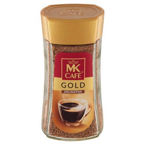 Kawa rozpuszczalna MK Café Gold Delikatna w szklanym słoiku. Na etykiecie filiżanka kawy.