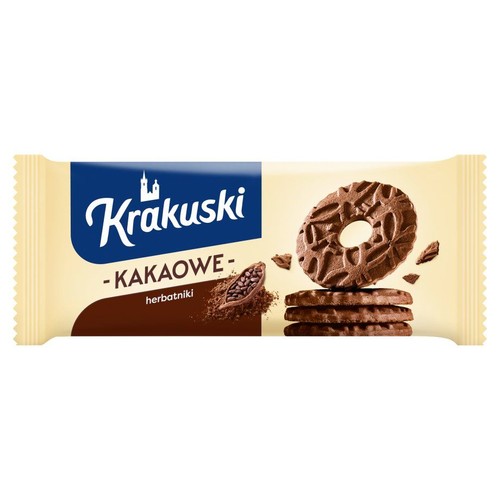 Kremowe opakowanie herbatników Krakuski Kakaowe. Na etykiecie grafika z ziarnami kakao i stos herbatników.