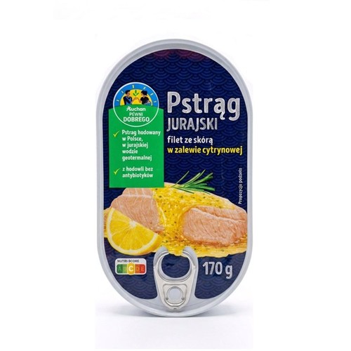 Konserwa Pstrąg Jurajski filet ze skórą w zalewie cytrynowej, 170 g. Produkt Auchan Pewni Dobrego. Pstrąg hodowany w Polsce, w jurajskiej wodzie geotermalnej, z hodowli bez antybiotyków. Na etykiecie grafika ryby z cytryną.