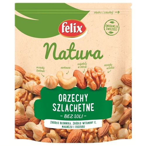 Opakowanie Felix Natura Orzechy Szlachetne Bez Soli. Na beżowym tle zielony pasek u góry. Widoczne orzechy laskowe, nerkowce, migdały w skórce i orzechy włoskie. Produkt jest źródłem błonnika, witaminy E, magnezu i fosforu.