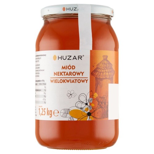 Słoik miodu wielokwiatowego Huzar o wadze 1,25 kg. Na etykiecie widnieje nazwa marki, rodzaj miodu oraz grafika przedstawiająca ul i stylizowane kwiaty. Słoik ma białą zakrętkę.