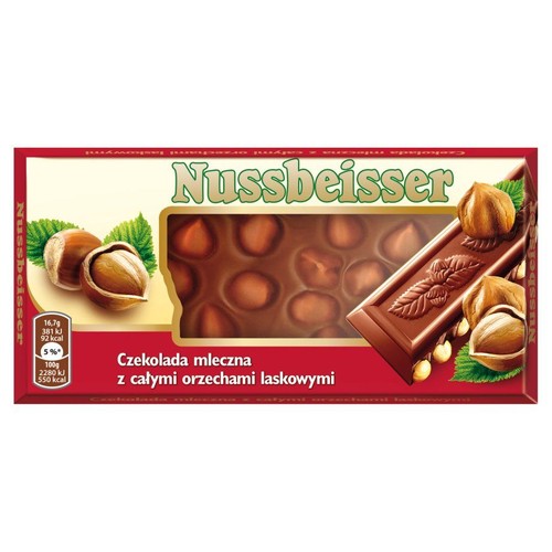 Produkt Nussbeisser: czekolada mleczna z całymi orzechami laskowymi w kartonowym opakowaniu. Opakowanie jest czerwono-białe, z dużym napisem Nussbeisser. Posiada okienko, przez które widać tabliczkę czekolady z orzechami. Waga netto 100g.