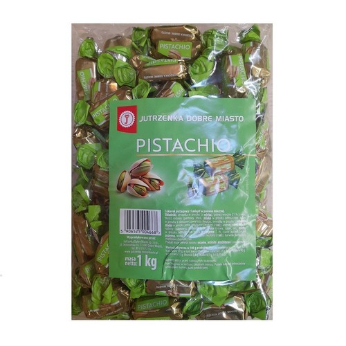 Cukierki pistacjowe JUTRZENKA DOBRE MIASTO w przezroczystej torbie. Opakowanie 1 kg, z zieloną etykietą i indywidualnie pakowanymi cukierkami.