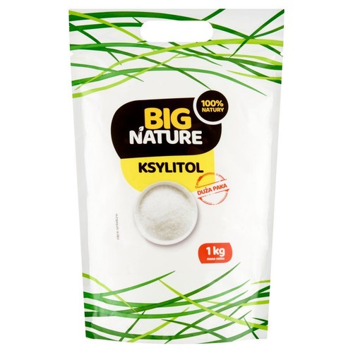 Opakowanie ksylitolu Big Nature, 1 kg. Biała torebka z zielonymi wzorami i grafiką białego proszku w miseczce.