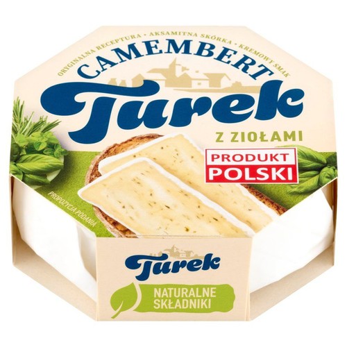 Ser Camembert Turek z ziołami w ośmiokątnym opakowaniu. Widoczny biały ser i grafika sugerująca podanie z pieczywem.